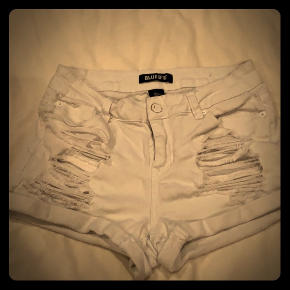 White ripped shorts